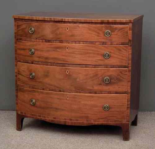 Appraisal: A late Georgian mahogany bow-front chest of drawers inlaid with