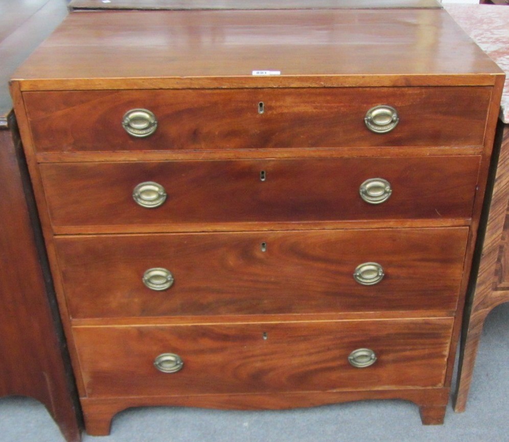 Appraisal: A George III mahogany and elm chest of four long