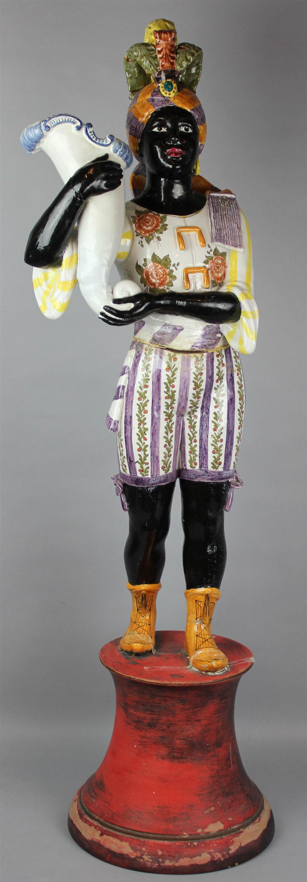 Appraisal: ITALIAN TIN-GLAZED POTTERY BLACKAMOOR FIGURE modeled in two parts standing