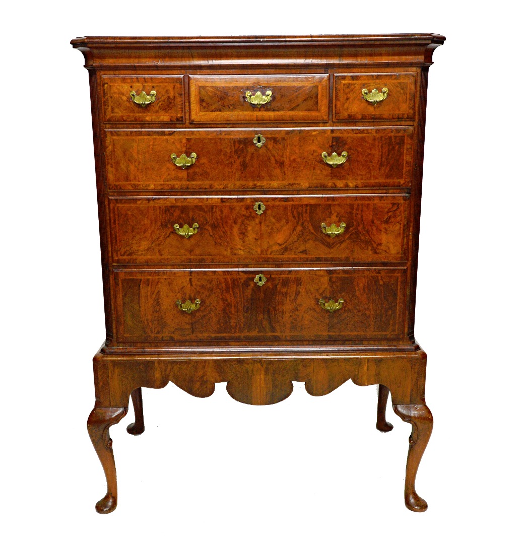 Appraisal: An early th century crossbanded figured walnut chest on stand