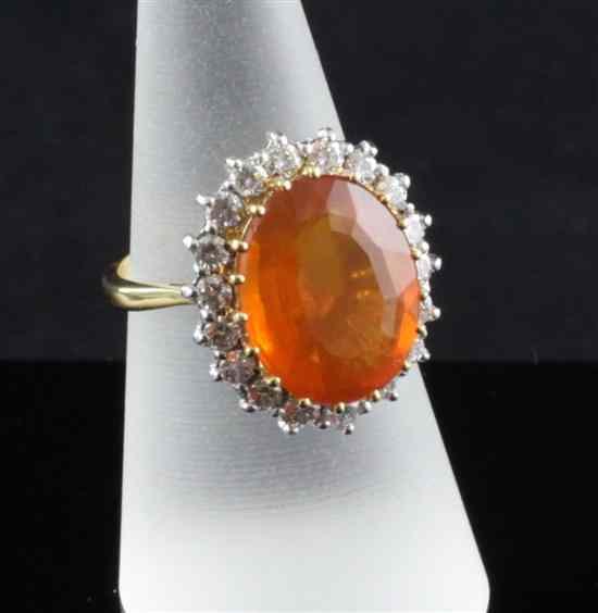 Appraisal: An ct gold diamond and fire opal oval cluster ring