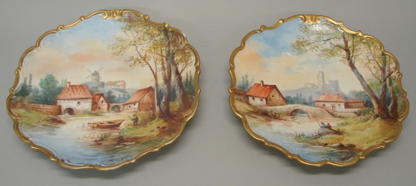 Appraisal: Hand painted chargers features landscape scenes One features ariver with