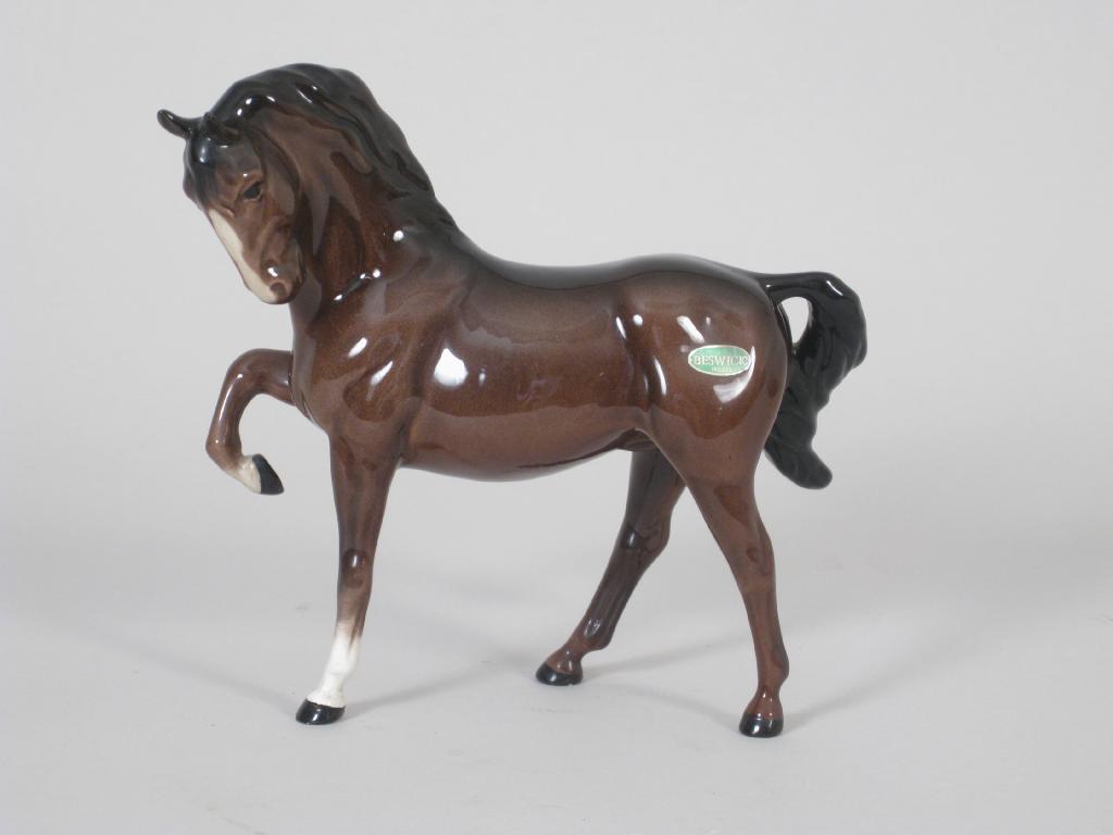 Appraisal: A Beswick brown Horse in and a Beswick King Charles