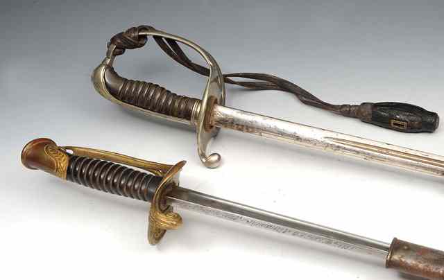 Appraisal: A FRENCH OFFICER'S SWORD with polished steel scabbard dated and