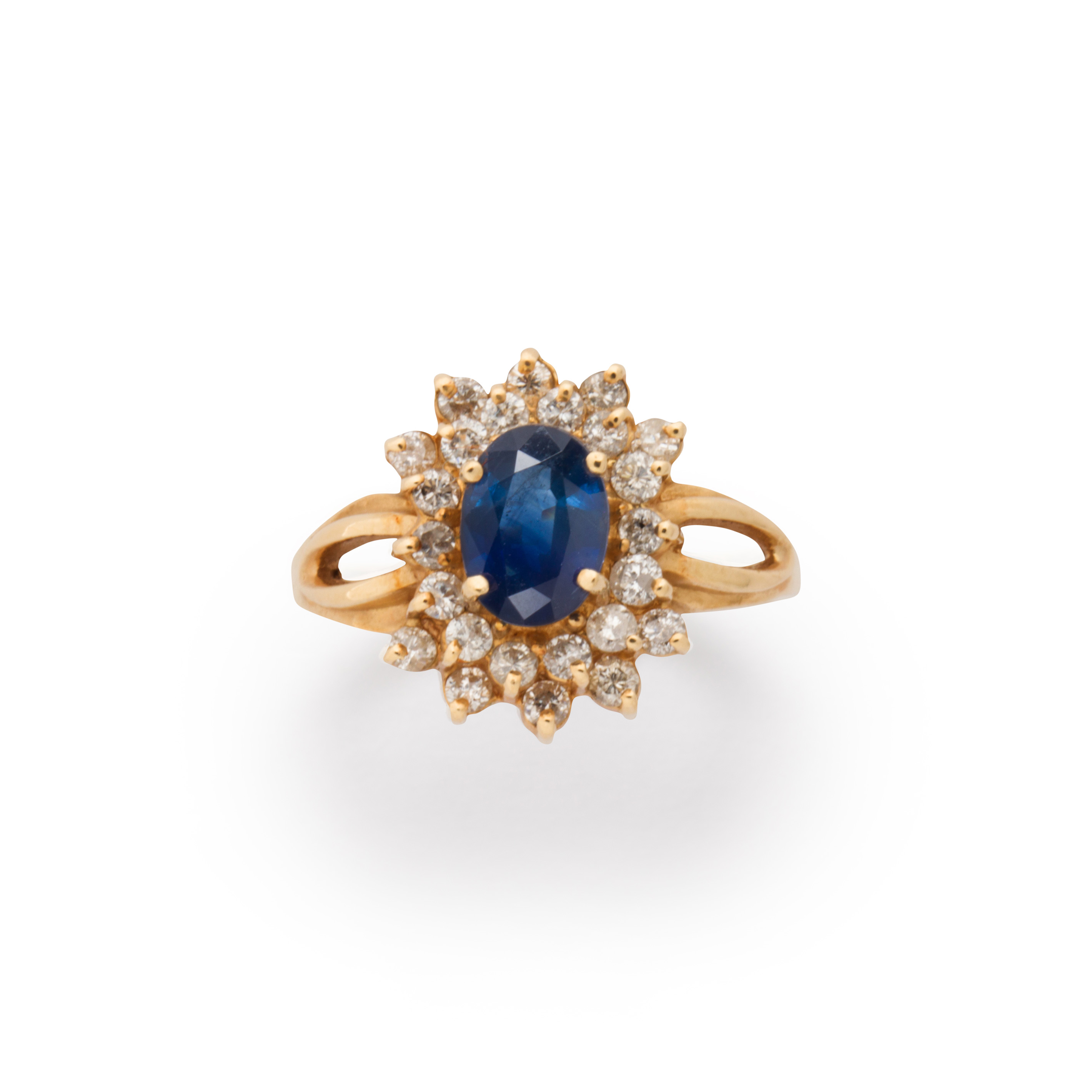 Appraisal: A SAPPHIRE DIAMOND AND FOURTEEN KARAT GOLD RING A sapphire