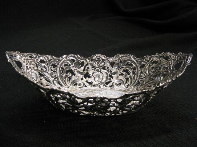 Appraisal: European Silver Sweetmeat Dish cherub decor canoe form long fine