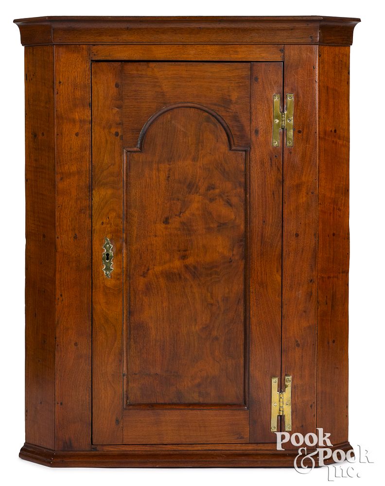 Appraisal: Pennsylvania walnut hanging corner cupboard Pennsylvania walnut hanging corner cupboard