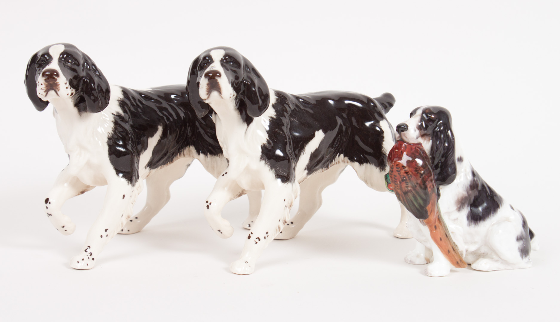 Appraisal: Three china springer spaniel figures Royal Doulton pointing spaniel with