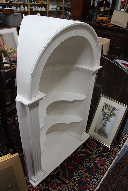 Appraisal: A WHITE PAINTED GEORGIAN STYLE CORNER ALCOVE with arching top