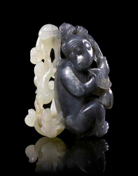 Appraisal: A Pierce Carved Black and White Jade Toggle of Monkeys