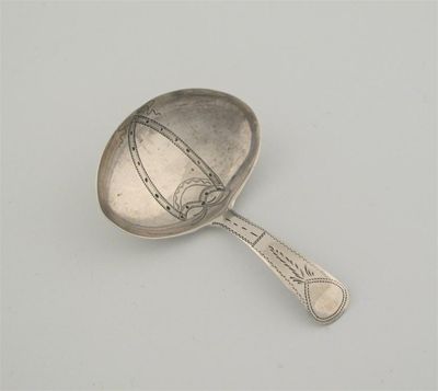 Appraisal: A George III navette spoon the bowl centred with a