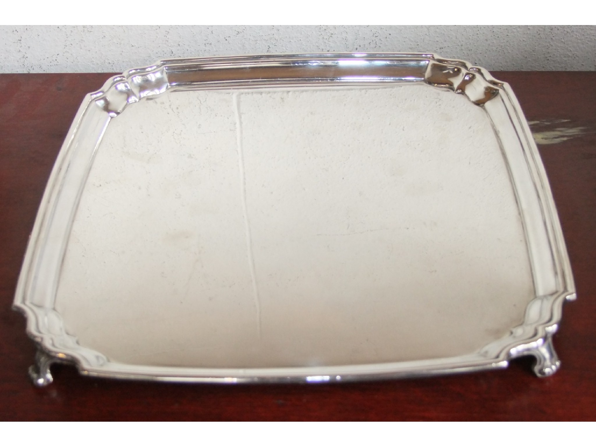 Appraisal: A simple Georgian style salver cm square with raised and