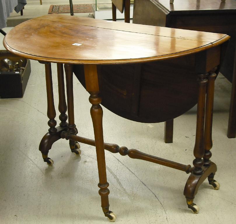 Appraisal: Victorian satinwood Sutherland table with baluster turned legs united by