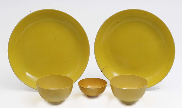 Appraisal: A pair of Chinese yellow ground large saucer dishes th