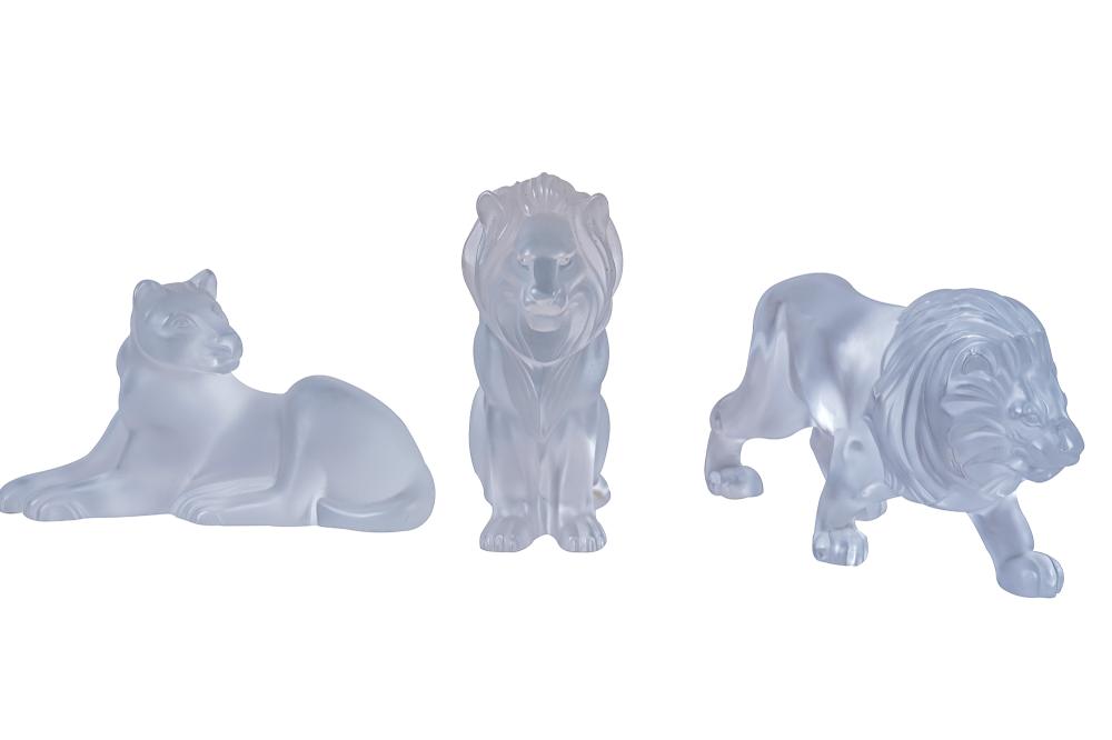 Appraisal: THREE LALIQUE LIONScomprising a standing seated male and a reclining