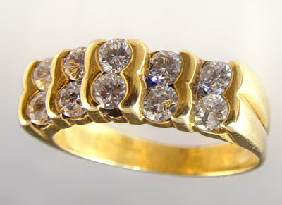 Appraisal: K CHANNEL SET STONE DIAMOND RING K yellow gold diamond