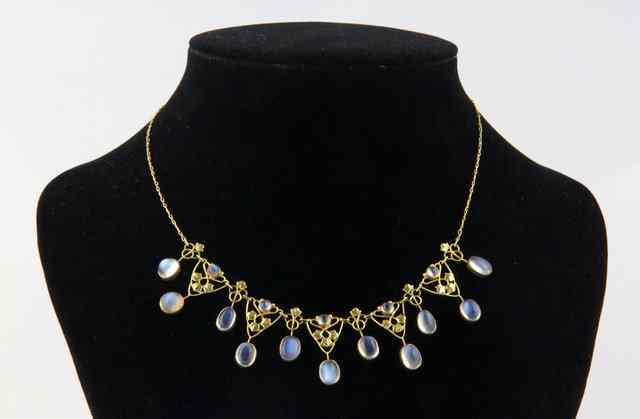 Appraisal: A moonstone set fringe necklet in a pierced ct gold