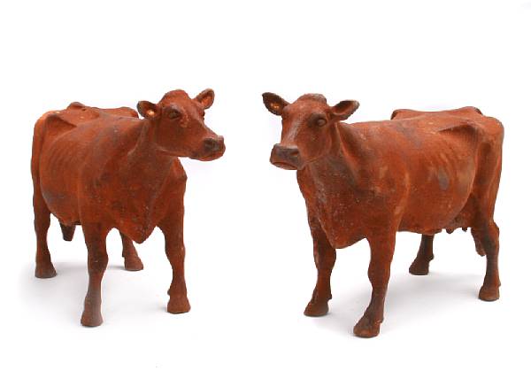 Appraisal: A pair of cast iron models of cows height in