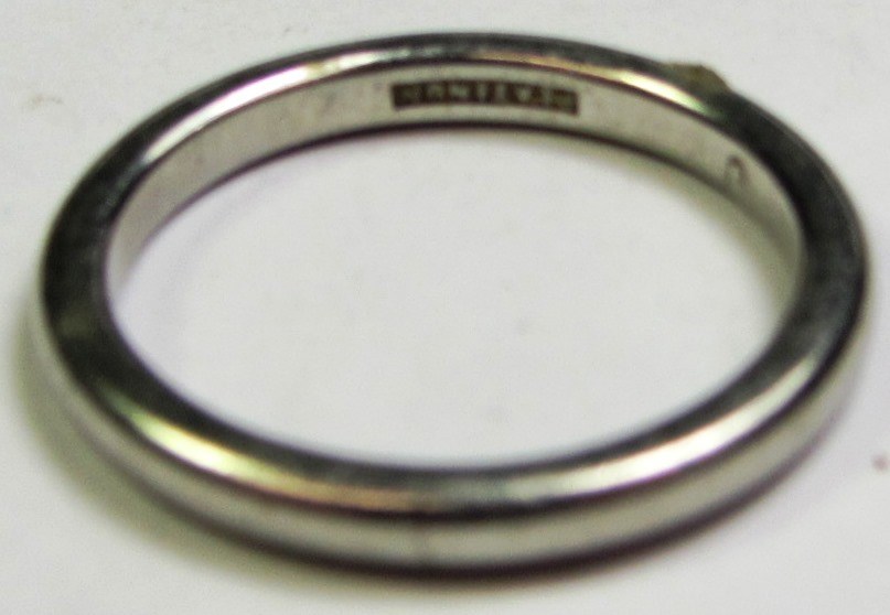 Appraisal: A platinum plain wedding ring ring size I and a