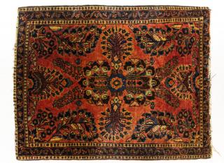 Appraisal: Sarouk Persian Rug The rose madder ground with blue borders