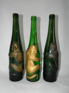 Appraisal: Wine Wine- green round embossed with monkey wrapped around bottle