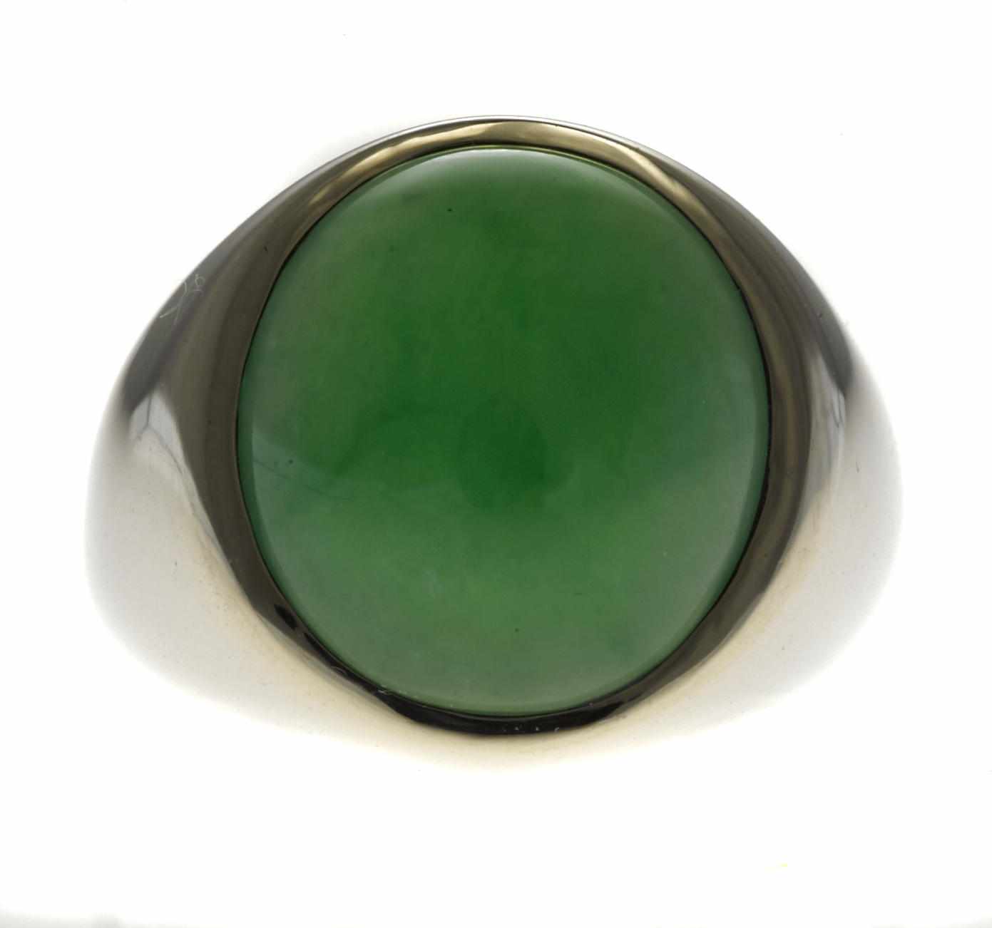 Appraisal: A jadeite jade ring off-round jadeite jade cabochon measuring x