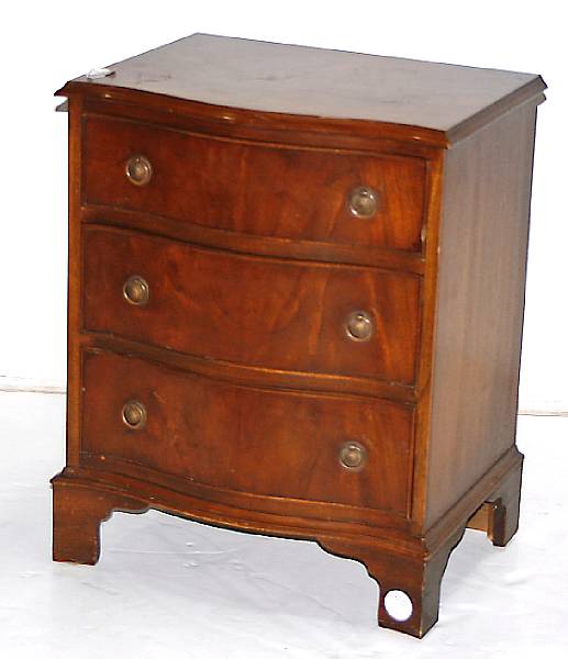 Appraisal: A George III style small serpentine chest of drawers th