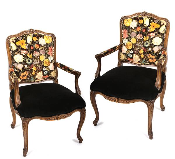 Appraisal: A pair of Louis XV style carved wood fauteuils by