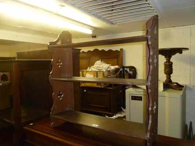 Appraisal: A SET OF OAK SHELVES with three tiers and pierced