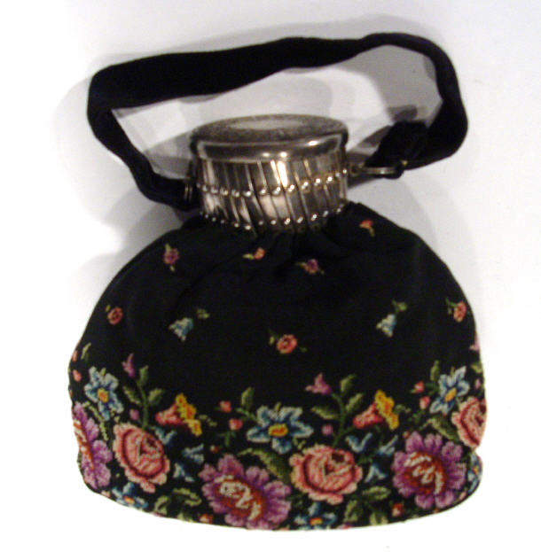 Appraisal: Edwardian cloth purse with floral tapestry detailing with expanding white