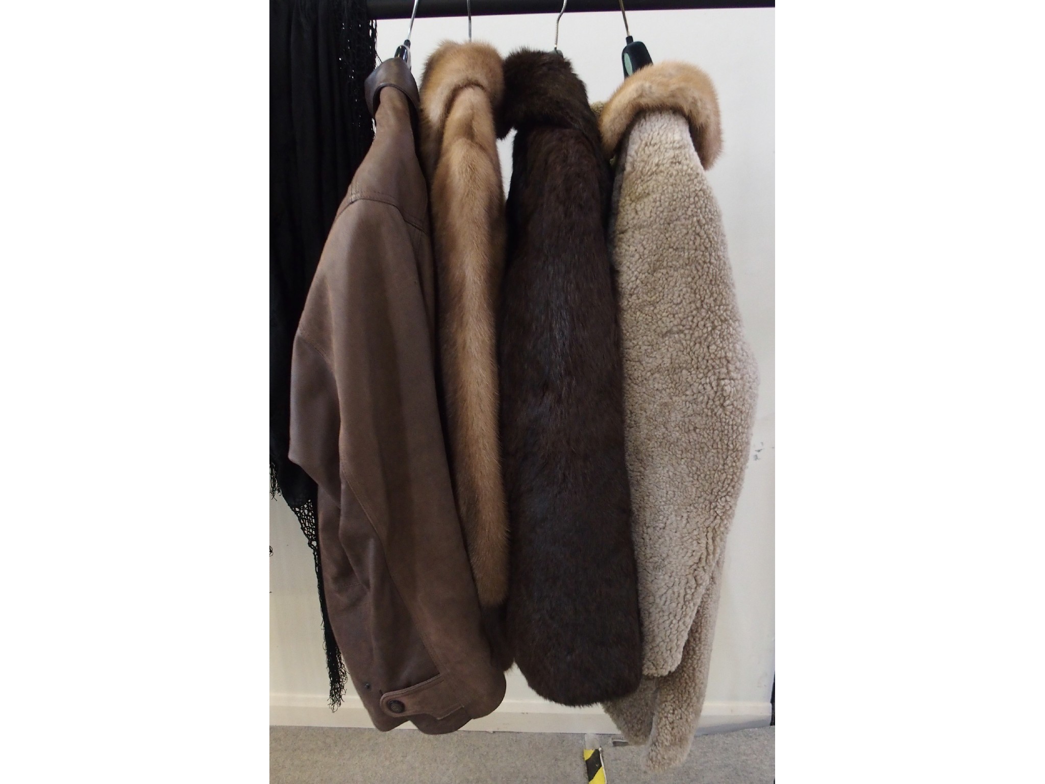 Appraisal: Two fur coats a gentleman's leather jacket and a sheepskin