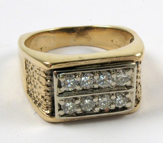 Appraisal: MAN'S DIAMOND AND FOURTEEN KARAT GOLD RING set with eight