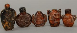 Appraisal: Five small amber snuff bottles carved with monkeys dragons mice