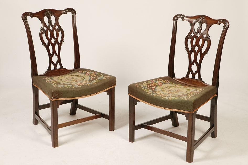 Appraisal: A PAIR OF GEORGE III MAHOGANY DINING CHAIRS of Chippendale