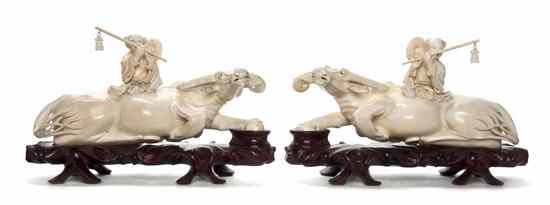 Appraisal: A Pair of Chinese Ivory Figures on Buffalo the carvings