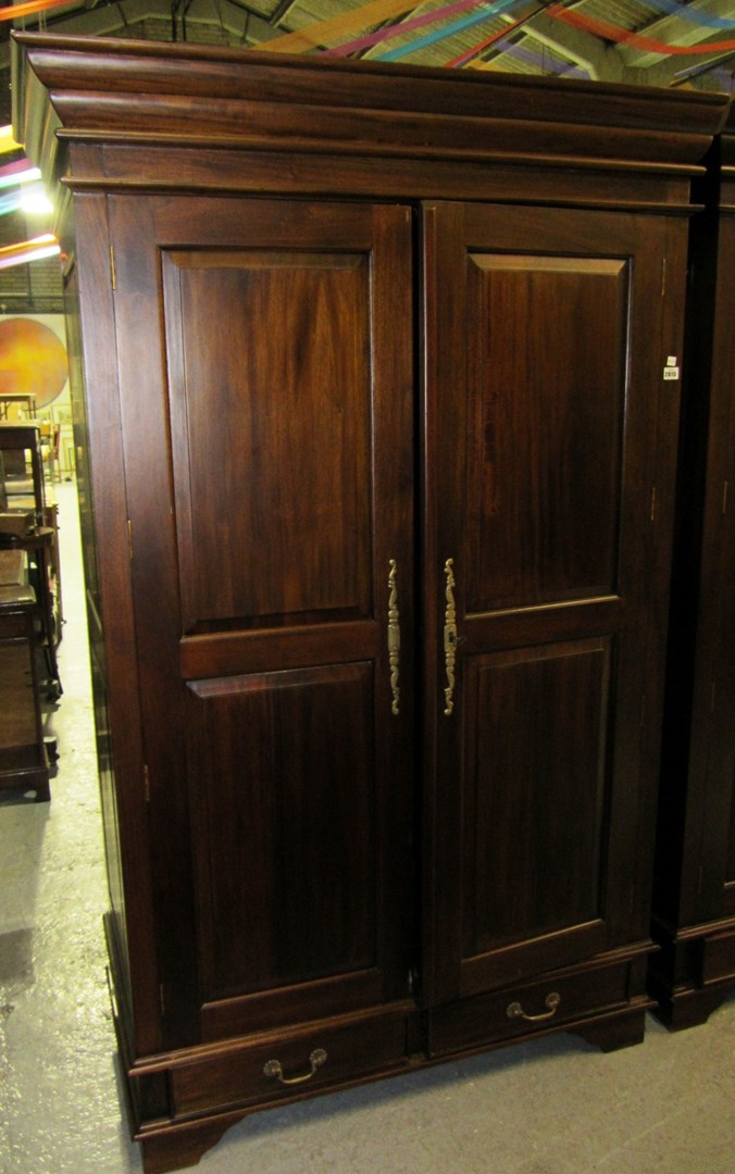 Appraisal: A large th century hardwood two door wardrobe