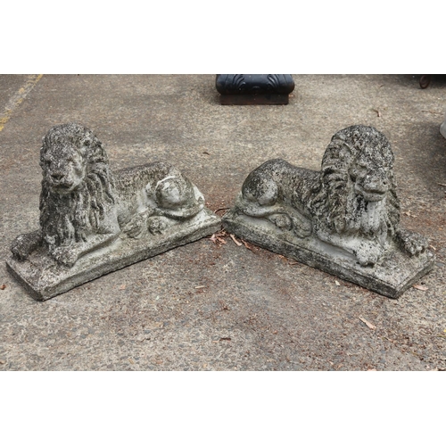 Appraisal: Pair of composite stone garden lions each approx cm H