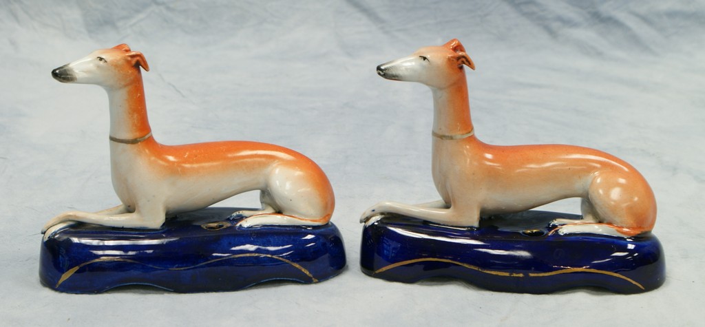 Appraisal: matching Staffordshire greyhound inkwells l h no damage