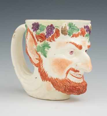 Appraisal: A Prattware Bacchus Mug Early glazed ceramic mug in the