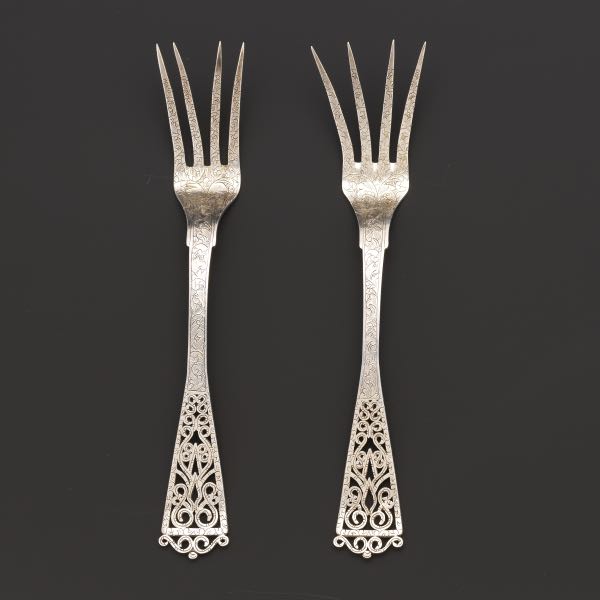 Appraisal: TWO DUTCH SILVER FORKS DATED Two Dutch chased silver forks