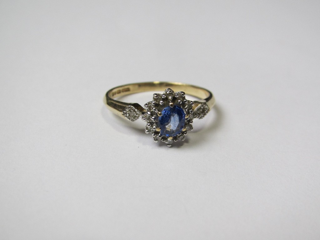 Appraisal: Nine carat gold Ceylon sapphire and diamond cluster ring