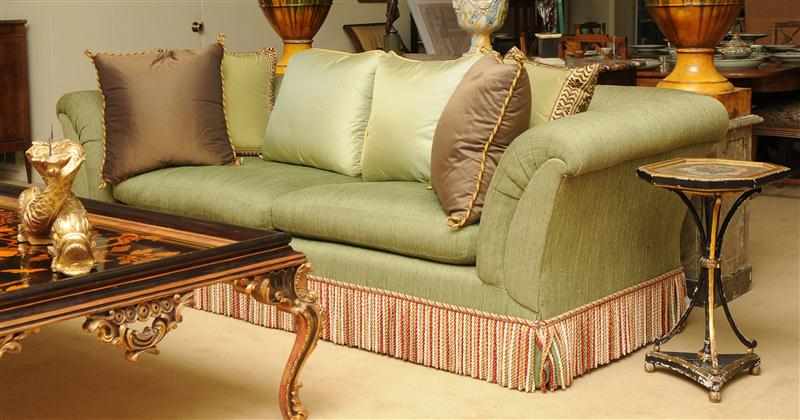 Appraisal: GREEN SILK AND WOOL BLEND UPHOLSTERED SOFA Fitted with bouillon