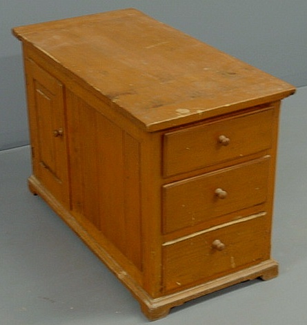 Appraisal: Pine storage cabinet with three drawers and two raised panel