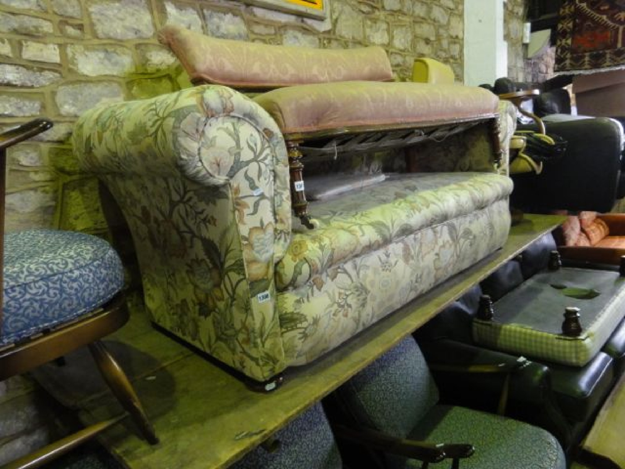 Appraisal: A late Victorian two seat Chesterfield sofa with rolled arms