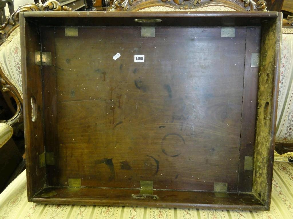 Appraisal: A Georgian mahogany butlers tray of rectangular form with folding