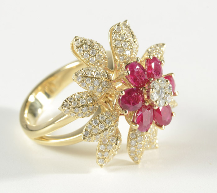 Appraisal: RUBY AND DIAMOND FLOWER MOTIF RING k yellow gold set