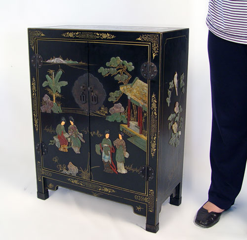 Appraisal: CHINESE DIMINUTIVE BLACK LACQUER CABINET Two door cabinet carved stone