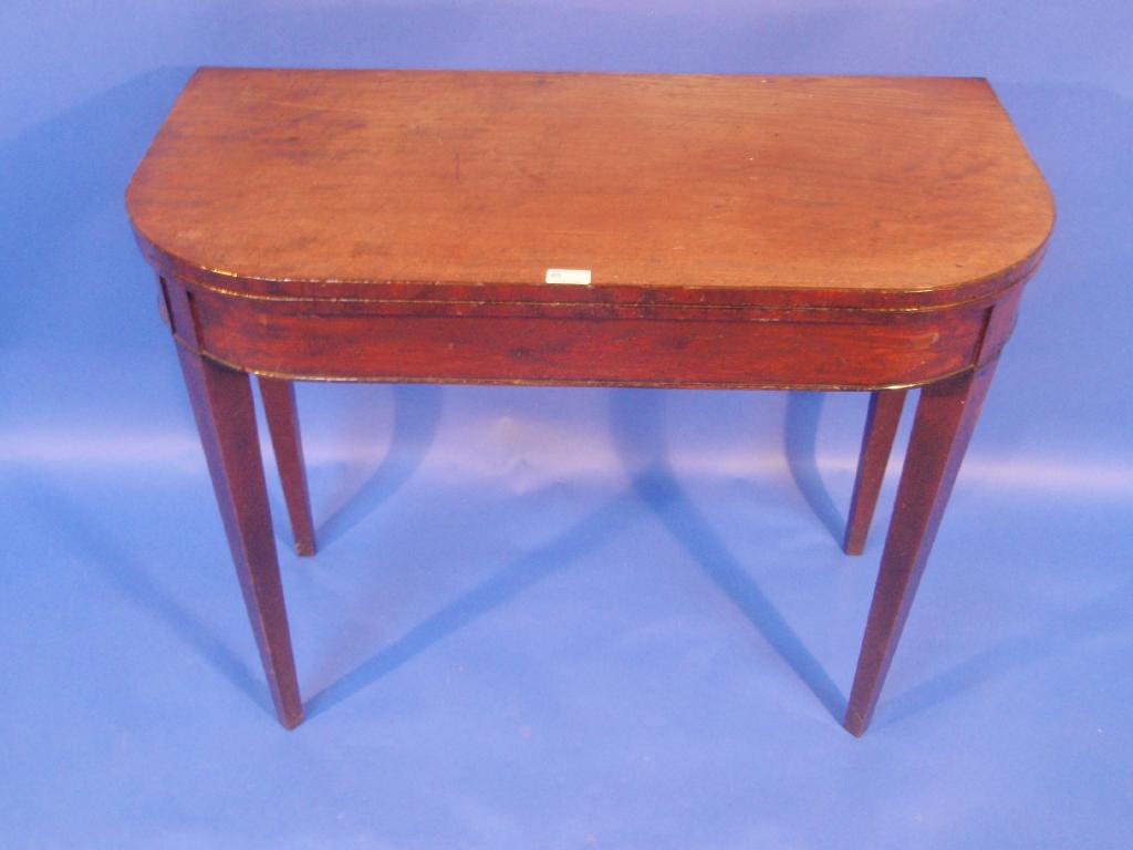 Appraisal: A George III mahogany tea table with rounded rectangular folding