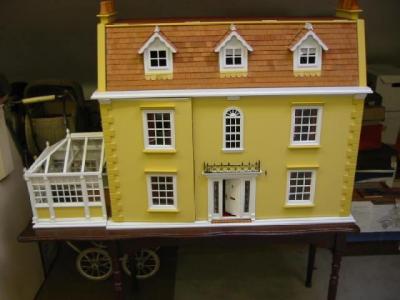 Appraisal: A late th century dolls house painted wood construction with