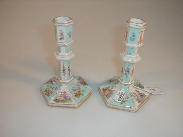 Appraisal: A pair of German porcelain boudoir candlesticks in the manner